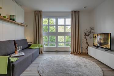 Bright apartment with a green view
