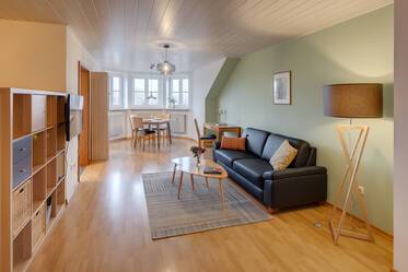 Bright attic apartment with sunny bay window