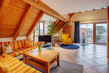 Spacious apartment with gallery and visible roof trusses