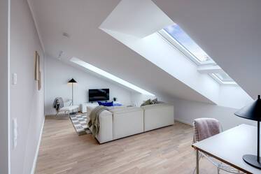 Light-flooded attic studio with open layout