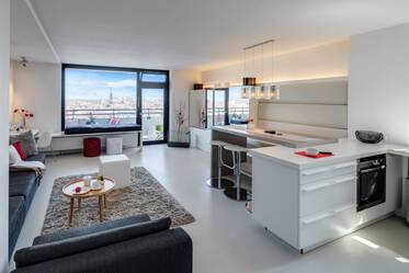 Premium: Breathtaking view over the city and the Alps, stylish 2-room apartment with two balconies