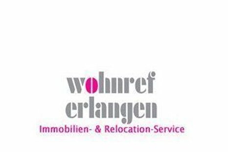 The photo shows the Immobilien Service in Franken GmbH logo