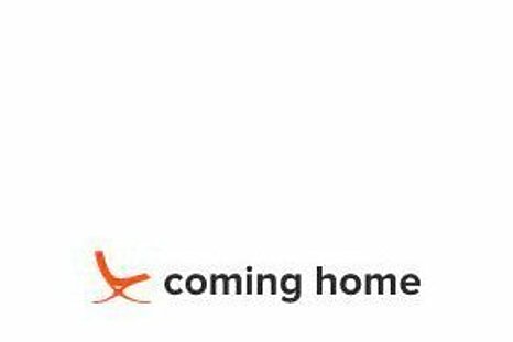 The photo shows the Coming Home logo