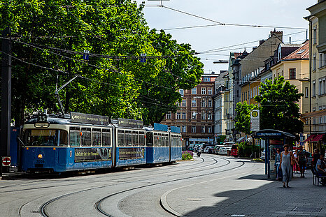 The photo shows a streetcar driving through the Haidhausen district